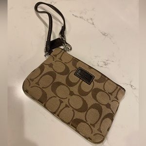 Coach signature wristlet.  EUC in brown fabric with leather details.